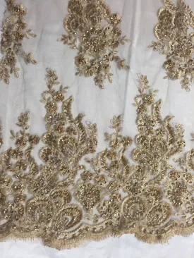 Metallic gold flowers embroider and heavy beaded on a mesh lace fabric-sold by the yard-